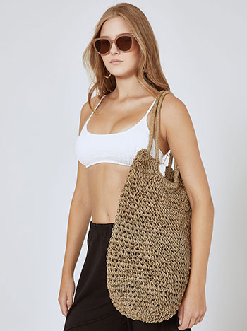 Knitted bag made from natural raffi materials in beige