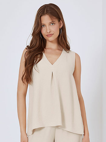Sleeveless top with pleat in beige