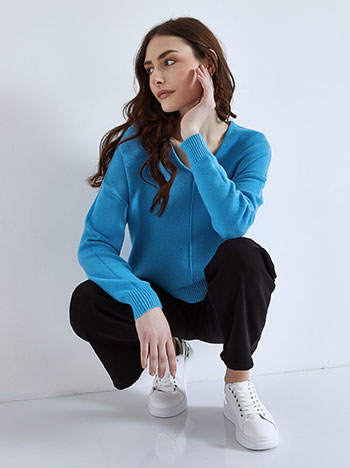 Asymmetric sweater in turquoise