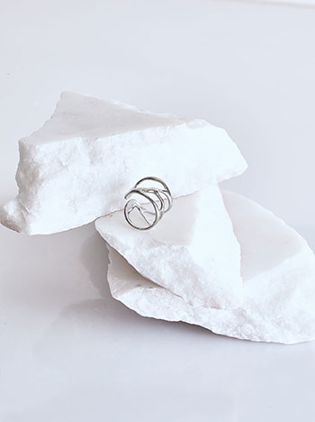 Ring with asymmetric cut-outs in silver
