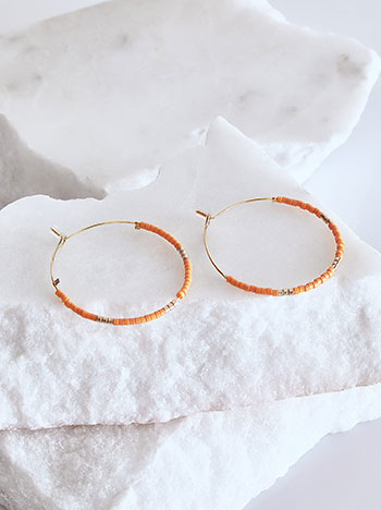 Hoop earrings with beads in orange
