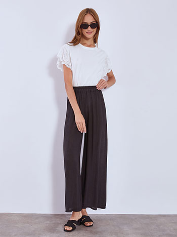 Wide leg trousers with textured fabric in black