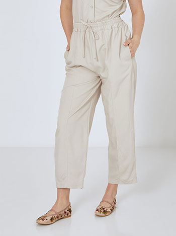 Trousers with decorative seams in beige