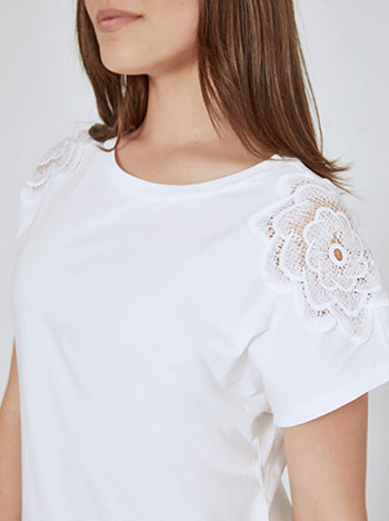 Top with broderie on shoulders in white