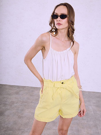 Denim shorts with rolled up hem in light yellow