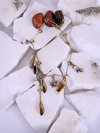 Necklace with dangling decorative charms in gold silver