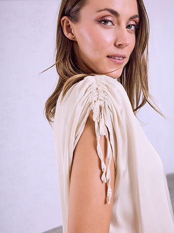 Top with ruched sleeves in light beige