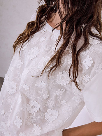 Top with embroidered details in white