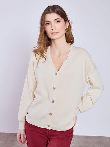Cardigan knitted with textured buttons in light beige