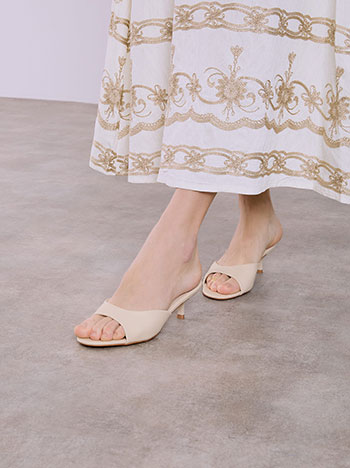 Leather effect mules in beige