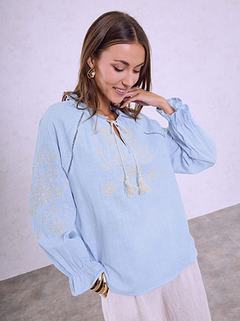 Blouse with ruffled neckline in sky blue