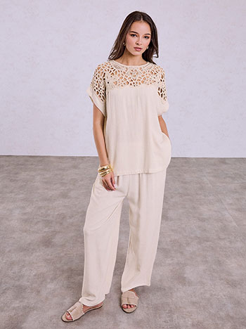 Top with sequins and wide leg trolusers set in light beige
