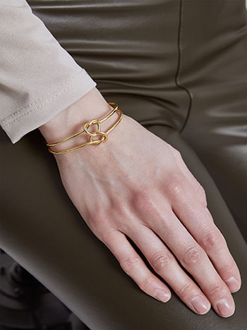 Cuff bracelet with knots in gold