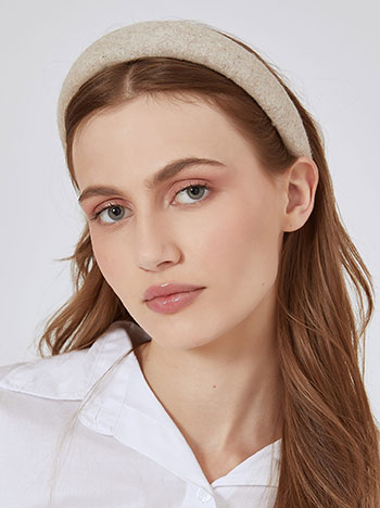 Headband knitted in light beige