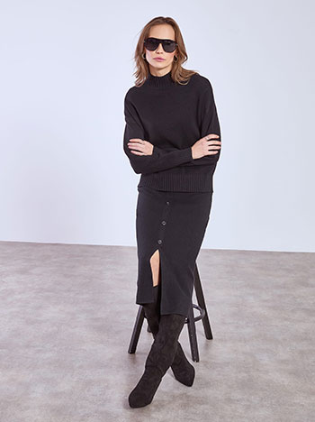 Sweater and skirt with buttons set in black