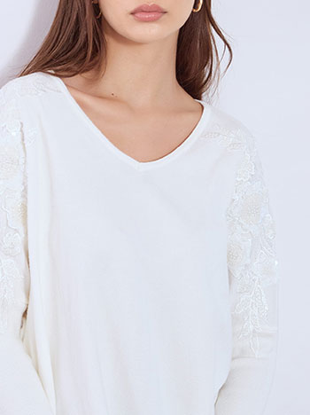 Sweater with sequins in white