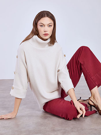 Turtleneck with metallic buttons in beige